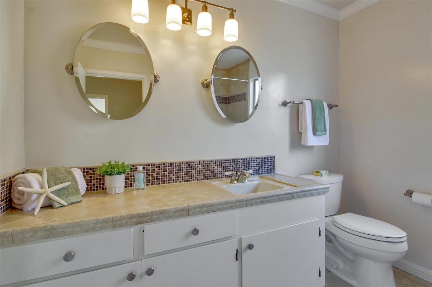 2891 Benjamin Avenue San Jose, CA 95124 - Photo 23 of 31 a bathroom with a sink and a mirror
