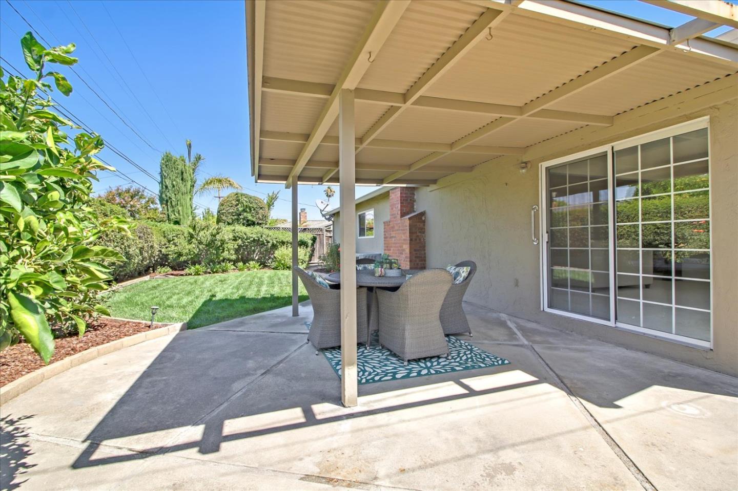 2891 Benjamin Avenue San Jose, CA 95124 - Photo 29 of 31 a view of a patio with table and chairs and potted plants
