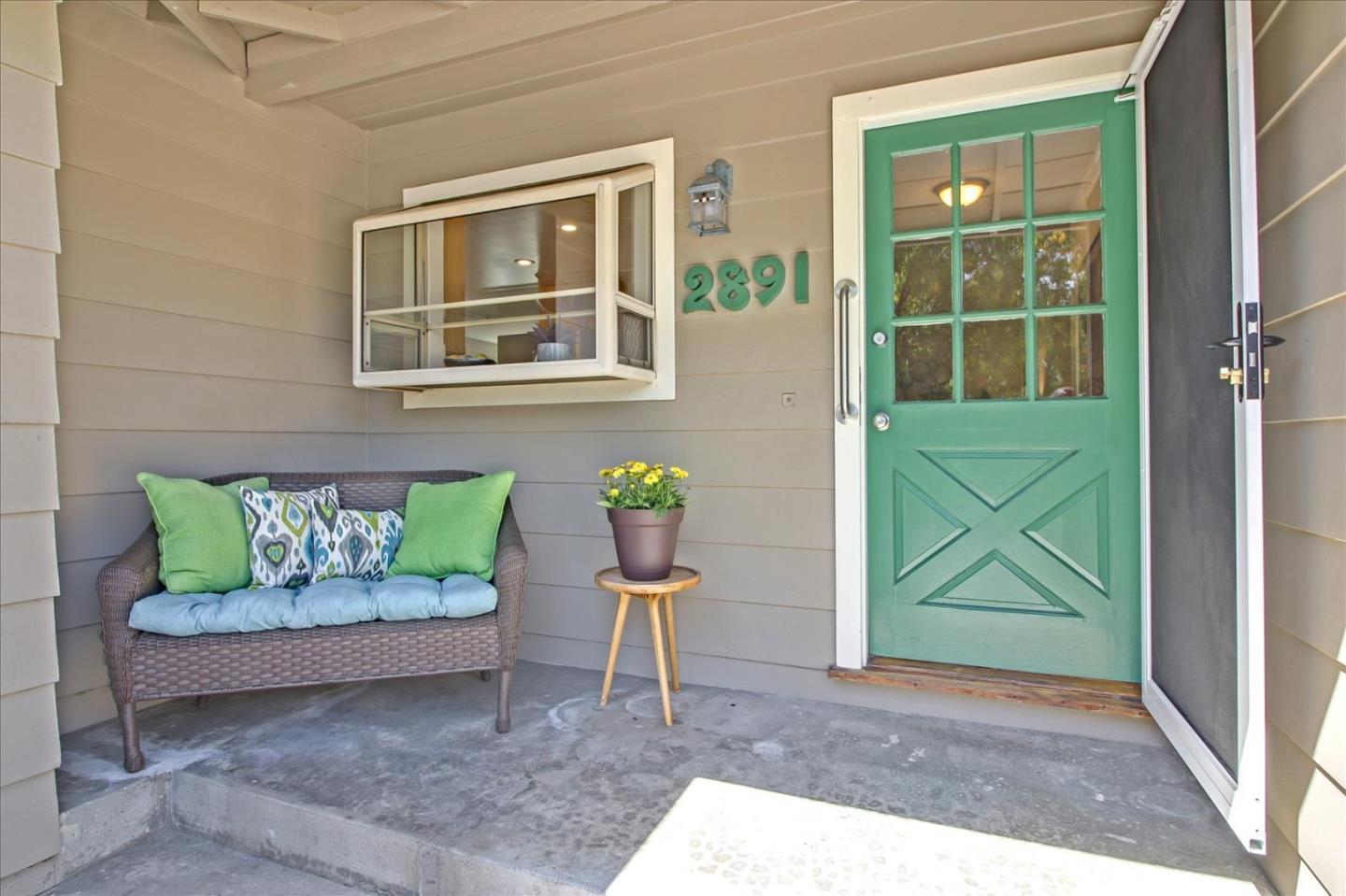 2891 Benjamin Avenue San Jose, CA 95124 - Photo 4 of 31 a porch with a bench and a chair