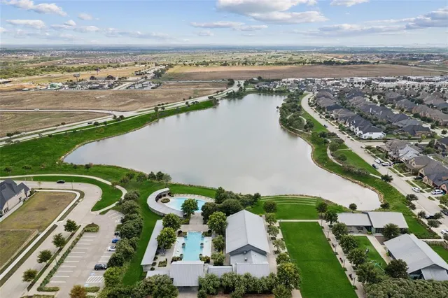 an aerial view of a house with outdoor space