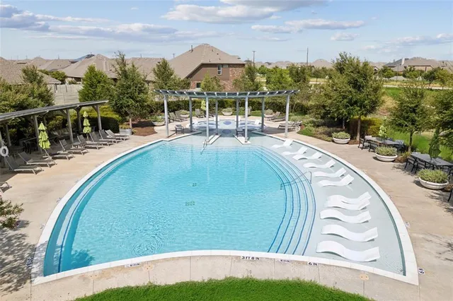 a view of a swimming pool with a patio