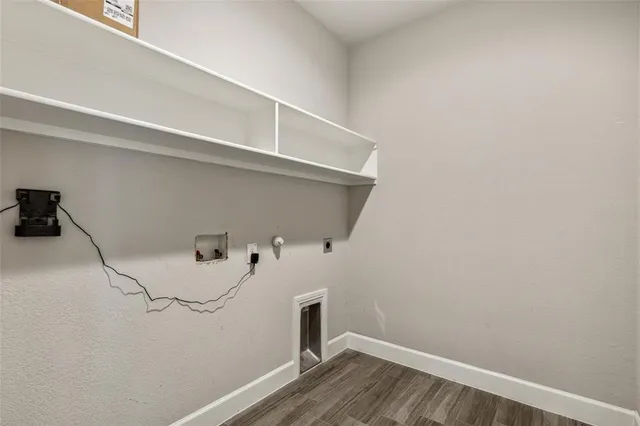 a view of storage and utility room with racks on the wall