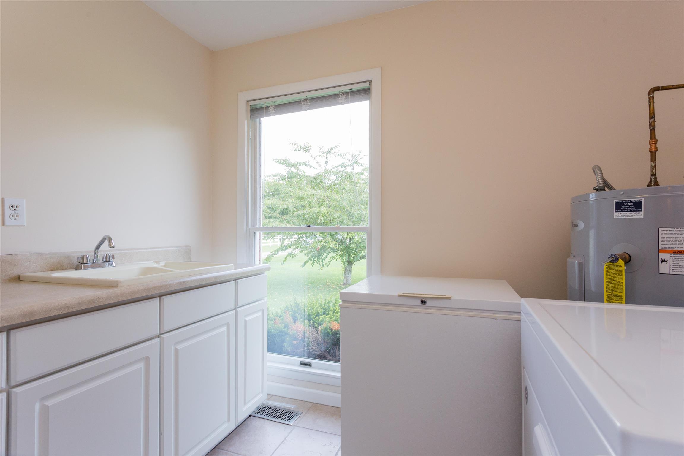 1029 Sandy Valley Road Hendersonville, TN 37075 - Photo 11 of 23 Laundry room with wash sink and plenty of storage.