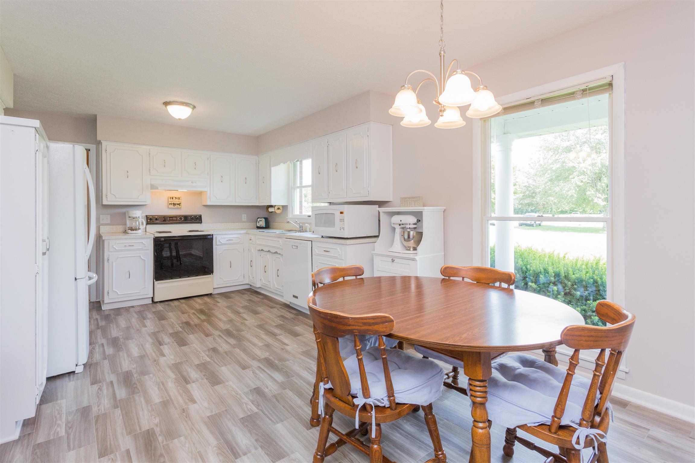 1029 Sandy Valley Road Hendersonville, TN 37075 - Photo 12 of 23 Country kitchen with new floors and hardwood cabinets!
