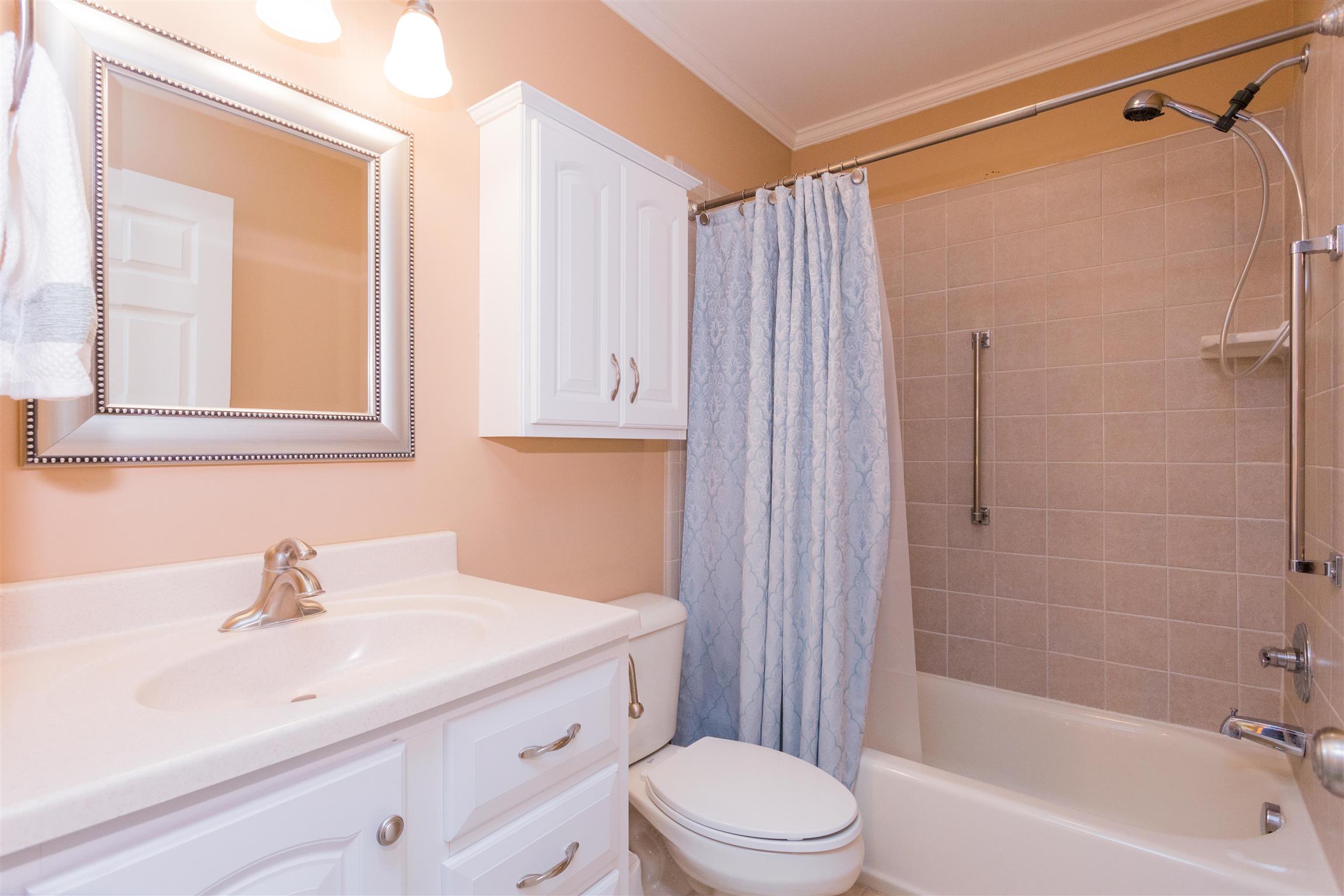 1029 Sandy Valley Road Hendersonville, TN 37075 - Photo 18 of 23 Tiled shower, tiled floors, and new vanity!