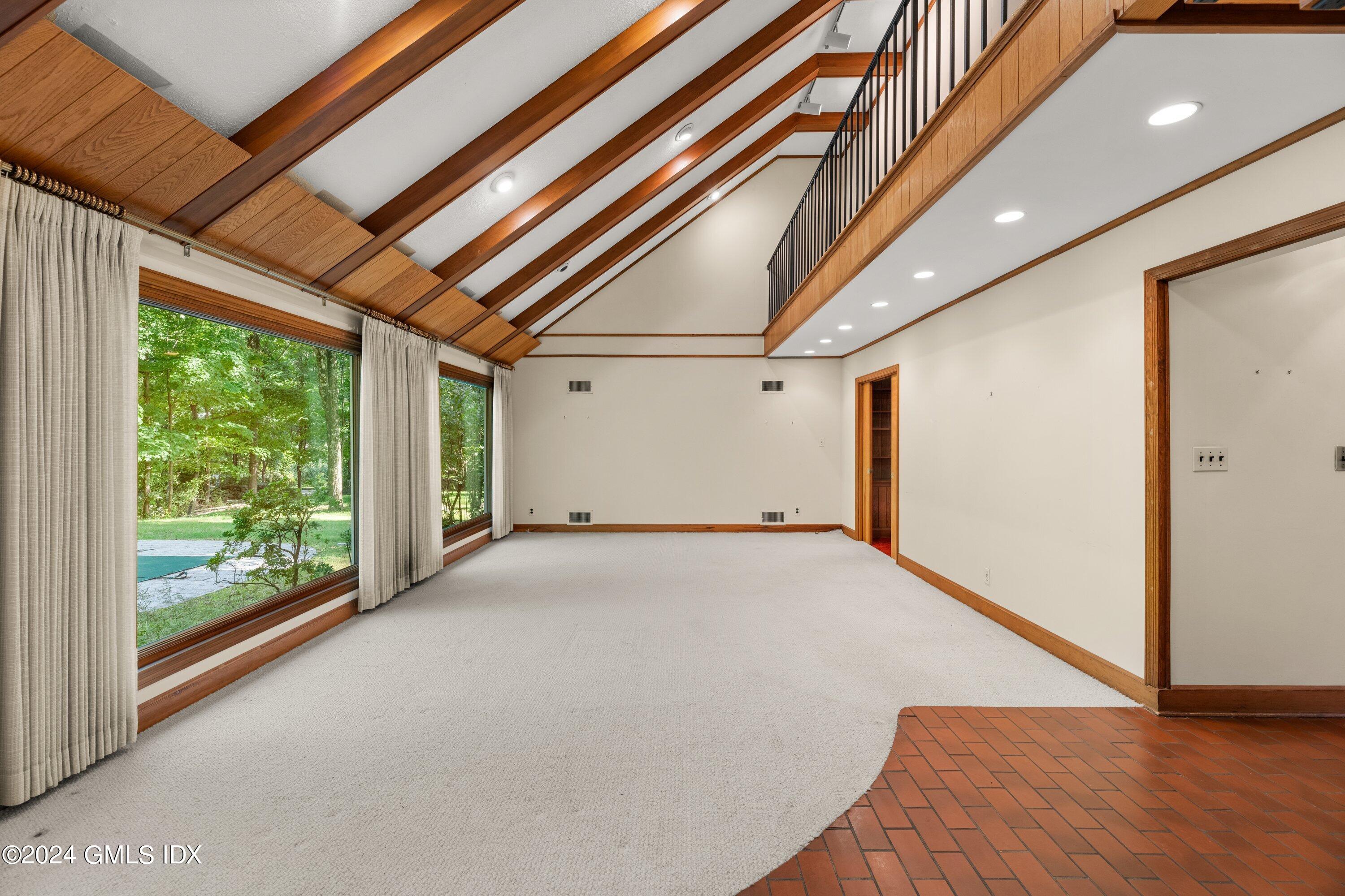 403 Stanwich Road Greenwich, CT 06830 - Photo 7 of 18 a view of empty room with wooden floor and fan