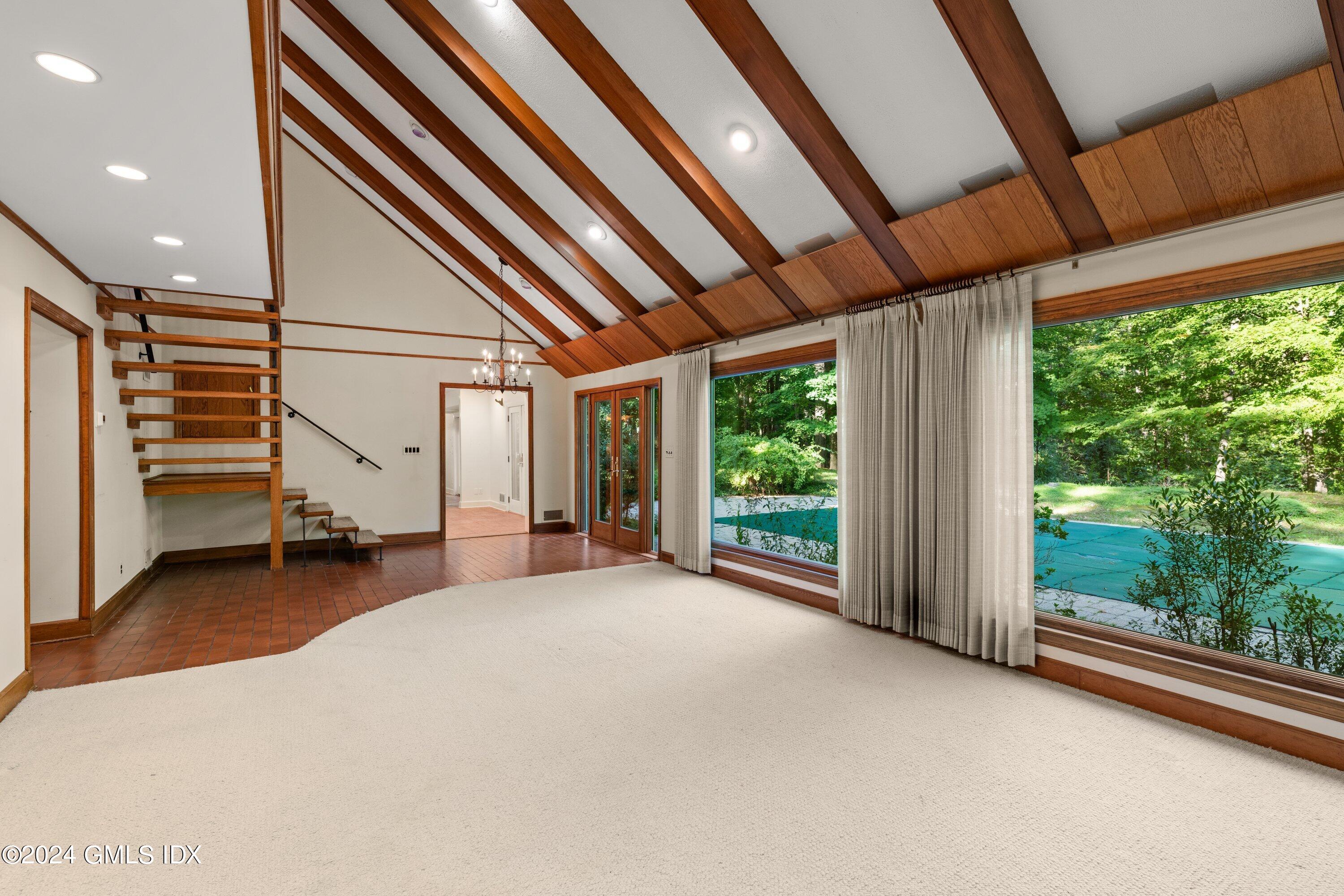 403 Stanwich Road Greenwich, CT 06830 - Photo 8 of 18 a view of an empty room with a balcony