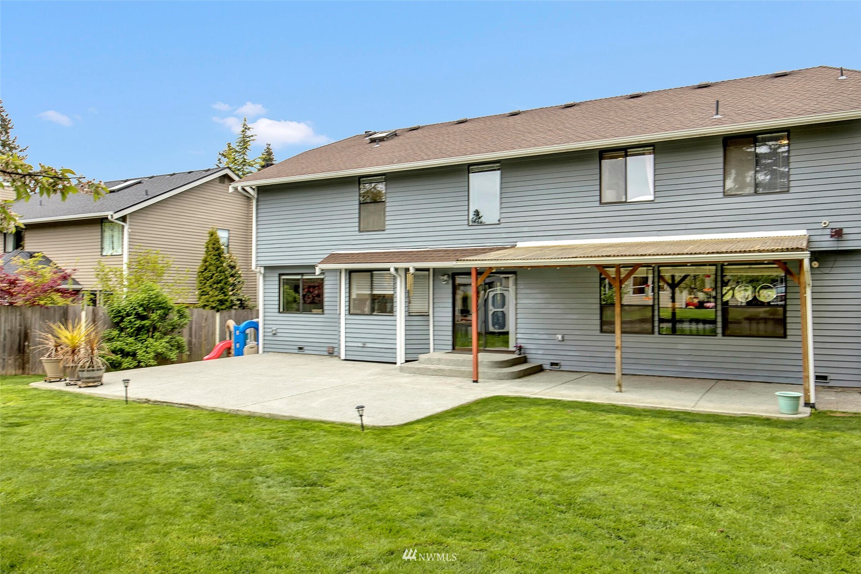 2002 238th Street Southeast Bothell, WA 98021 - Photo 35 of 40 a front view of a house with a yard