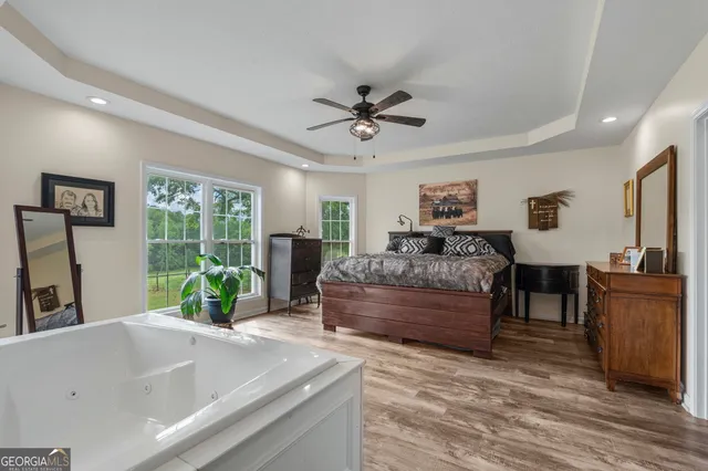 a bathroom with a granite countertop sink a toilet and a mirror