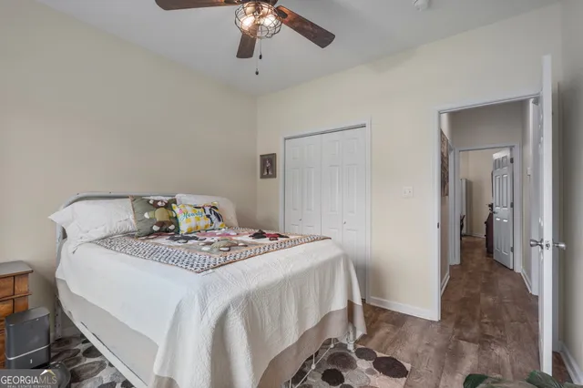 a kitchen with granite countertop a wooden floor and a sink