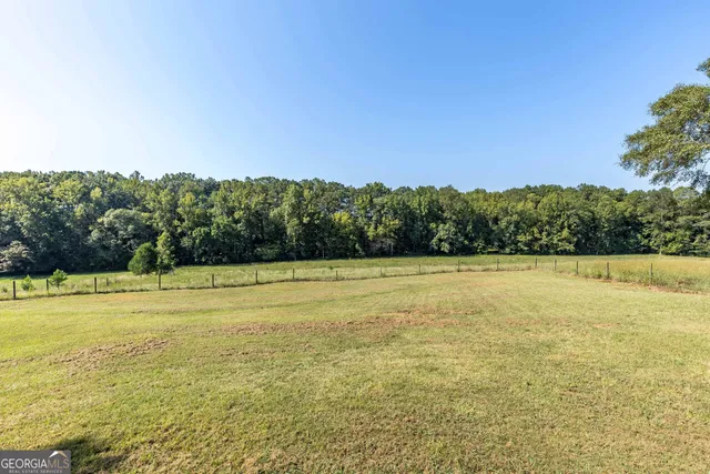 a view of a lake with a yard