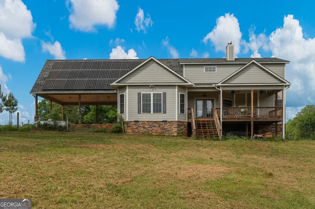 a view of a backyard with outdoor space