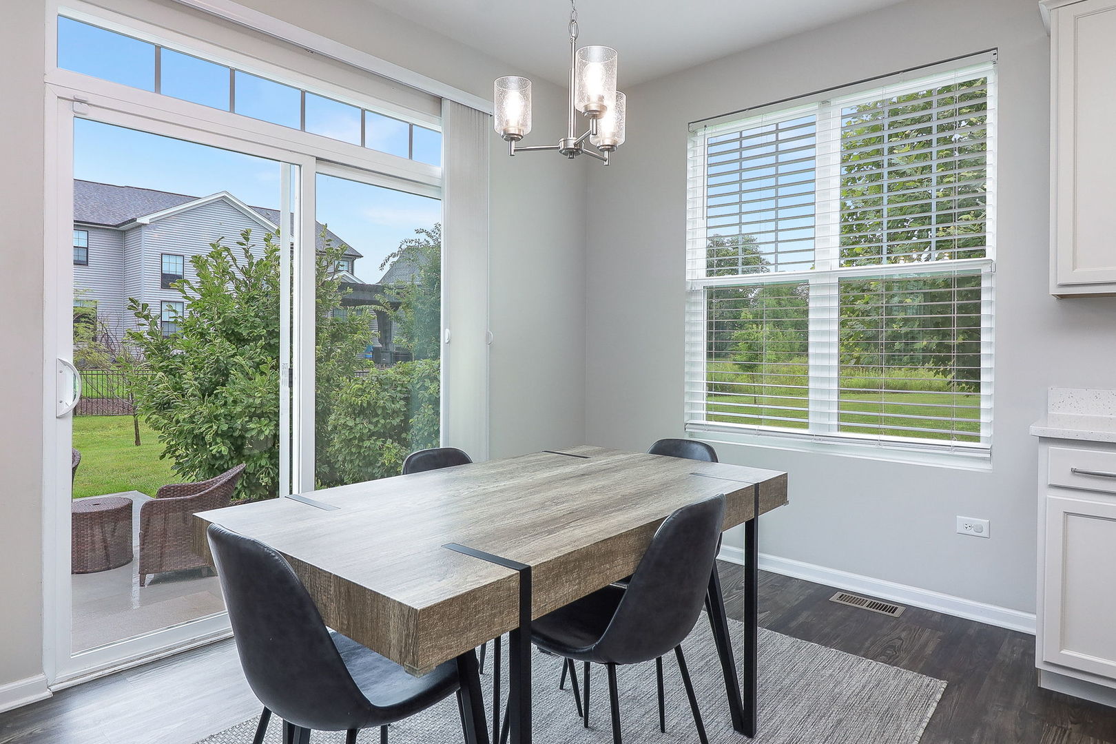 26537 West Countryside Lane Plainfield, IL 60585 - Photo 5 of 19 a view of a dining room with furniture window and wooden floor