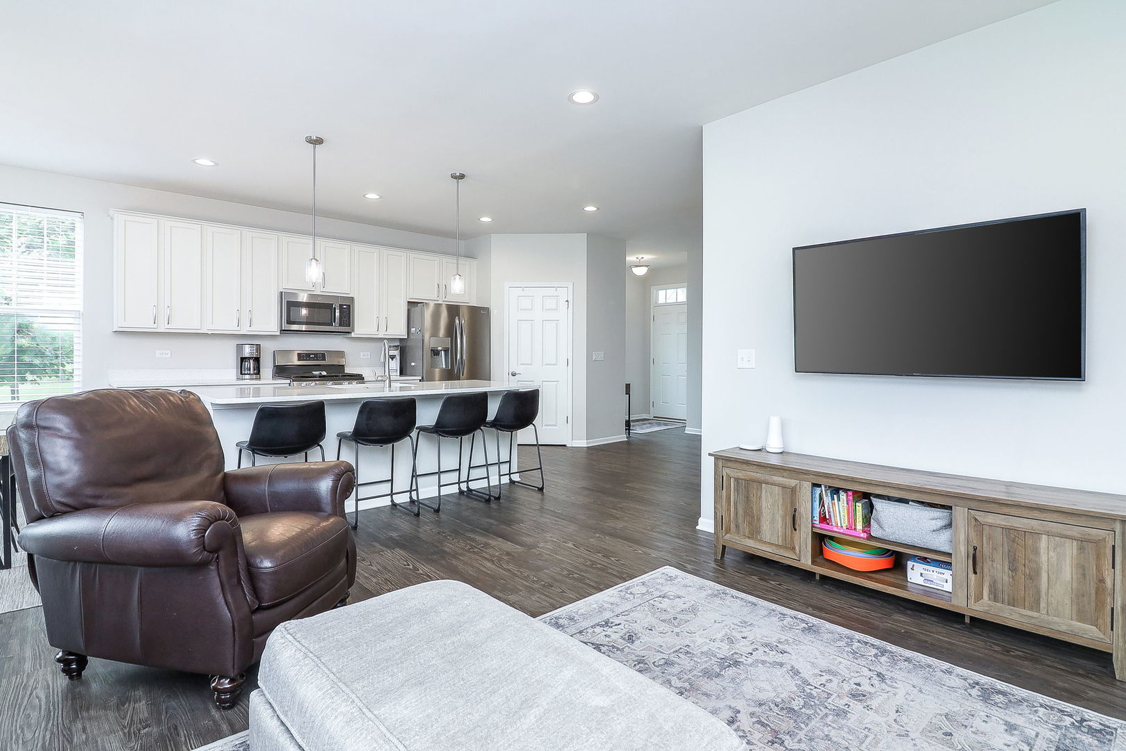 26537 West Countryside Lane Plainfield, IL 60585 - Photo 6 of 19 a living room with furniture and a flat screen tv