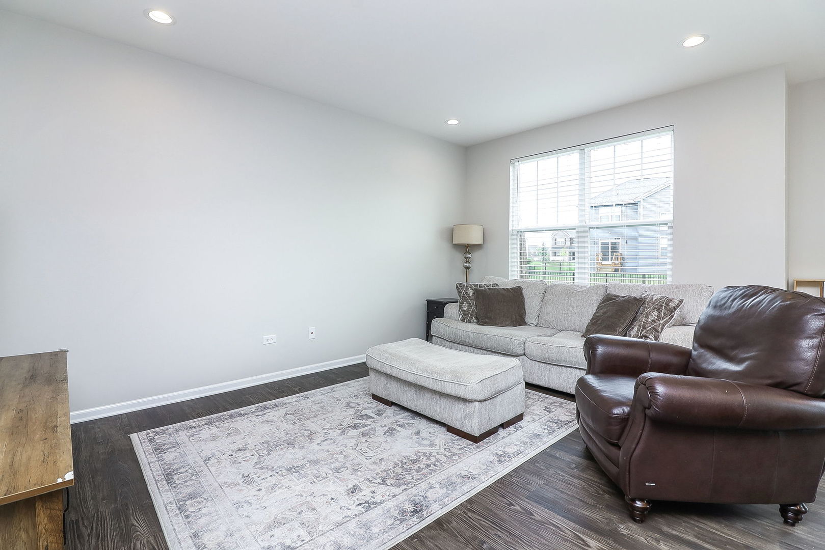 26537 West Countryside Lane Plainfield, IL 60585 - Photo 7 of 19 a living room with furniture and a rug