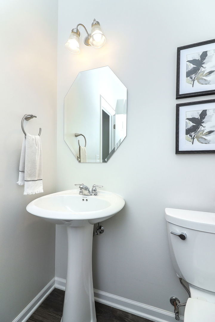 26537 West Countryside Lane Plainfield, IL 60585 - Photo 8 of 19 a bathroom with a toilet a sink and mirror