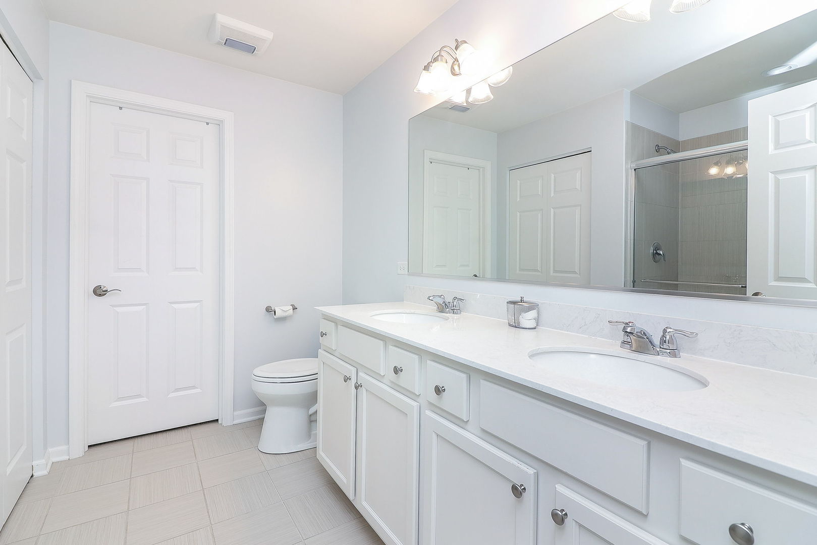 26537 West Countryside Lane Plainfield, IL 60585 - Photo 10 of 19 a spacious bathroom with a double vanity sink toilet and a mirror