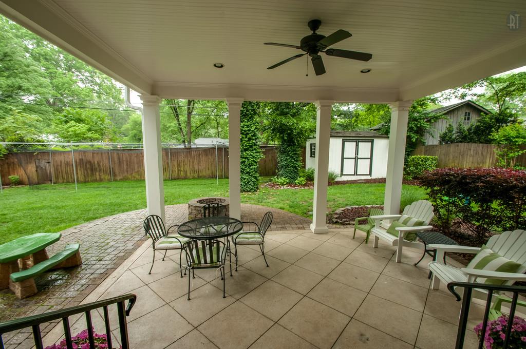 406 Page Road Nashville, TN 37205 - Photo 22 of 22 a view of a patio with a table chairs and a yard