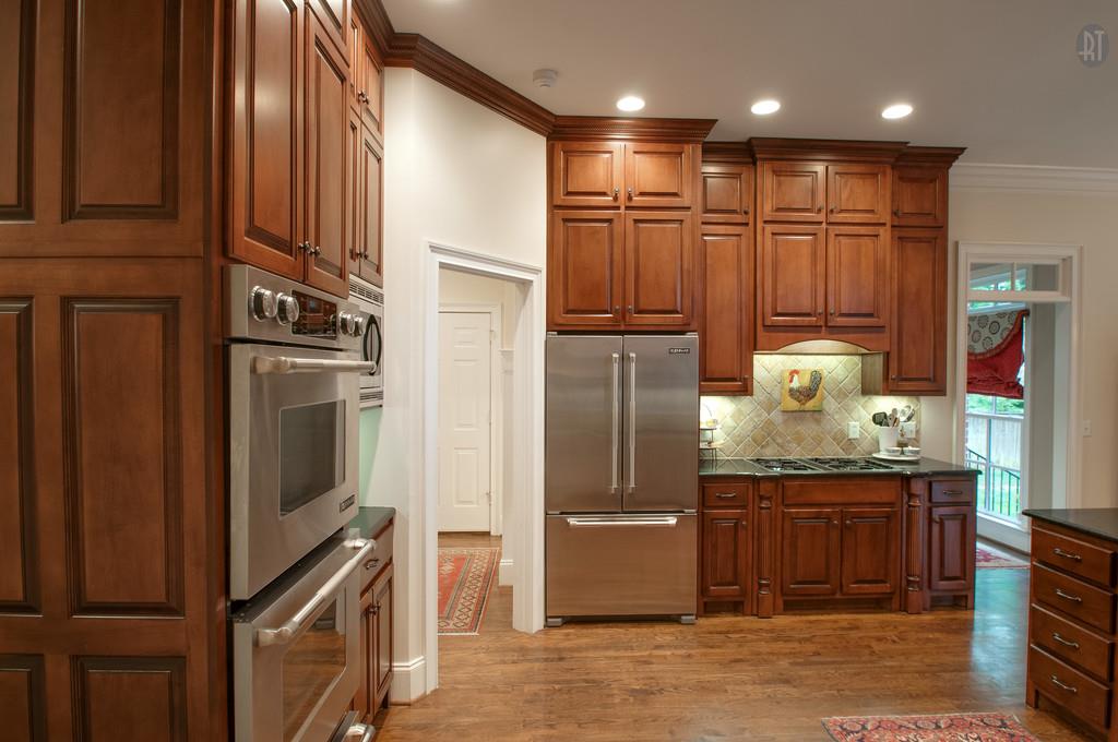 406 Page Road Nashville, TN 37205 - Photo 5 of 22 a kitchen with stainless steel appliances granite countertop a refrigerator a sink and wooden cabinets