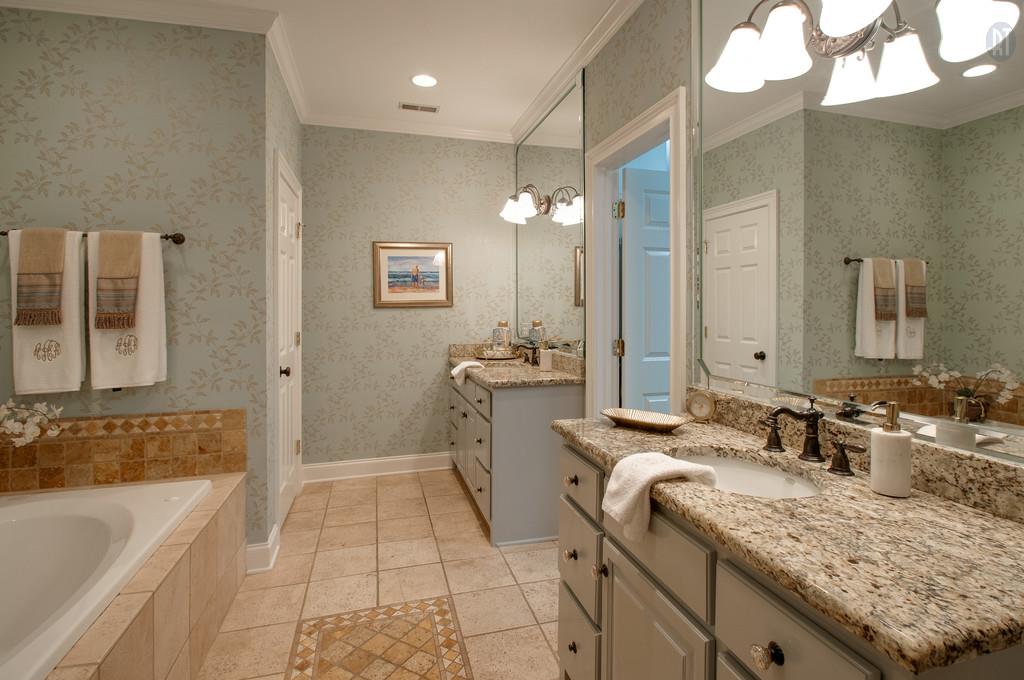 406 Page Road Nashville, TN 37205 - Photo 10 of 22 a bathroom with a tub sink and mirror