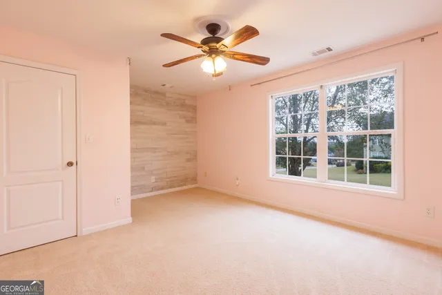 a view of a bathroom from a hallway