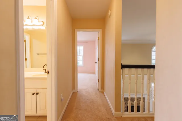 a bathroom with a double vanity sink a mirror and a shower