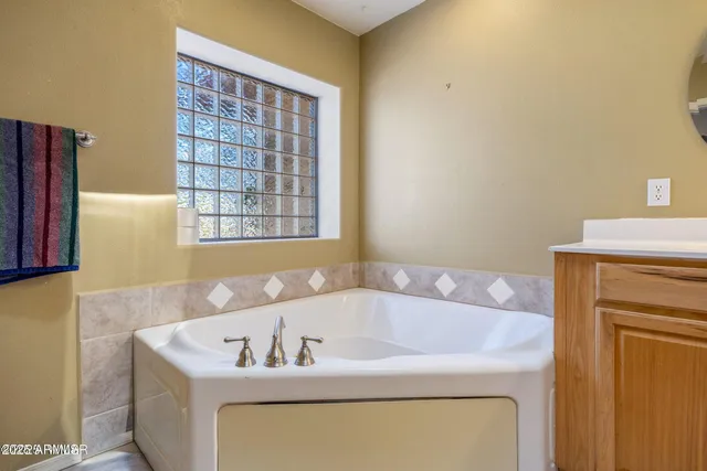 a bath tub sitting next to a window
