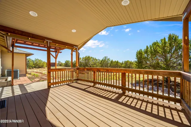 a view of balcony with wooden floor