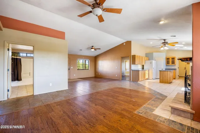 a view of a hall with wooden floor