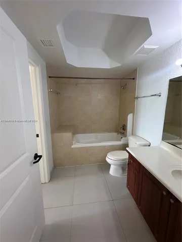 a bathroom with a toilet a sink and bathtub