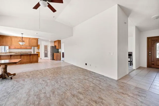 a view of a kitchen with a sink and cabinets