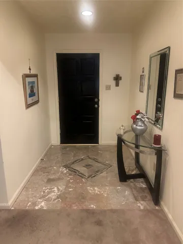 a room with furniture and a flat screen tv