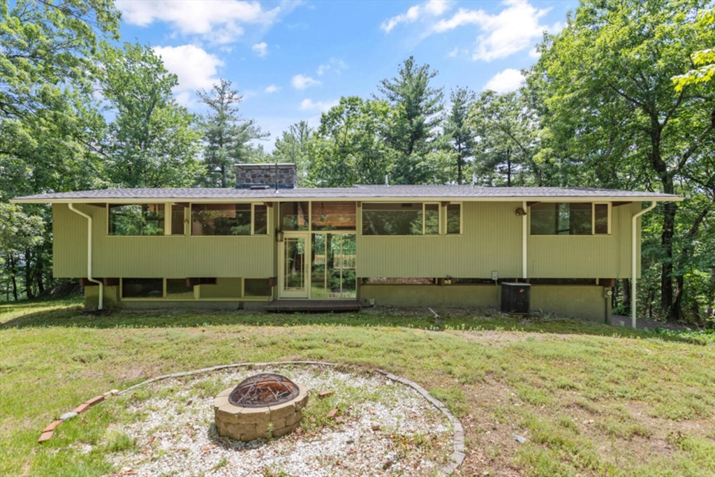 15 Pilgrims Path Sudbury, MA 01776 - Photo 1 of 29 a view of a house with backyard and sitting area