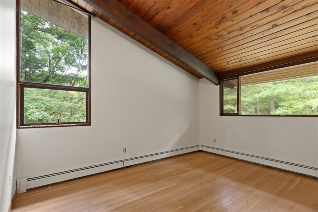15 Pilgrims Path Sudbury, MA 01776 - Photo 14 of 29 a view of empty room with wooden floor and fan