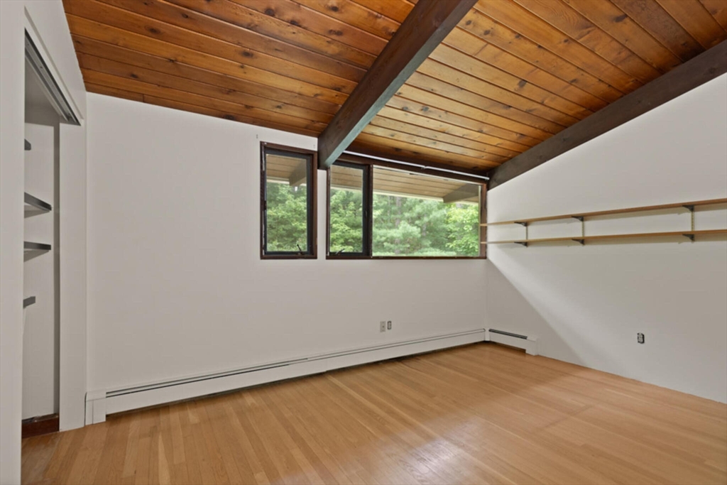 15 Pilgrims Path Sudbury, MA 01776 - Photo 15 of 29 a view of a room with wooden floor and white walls