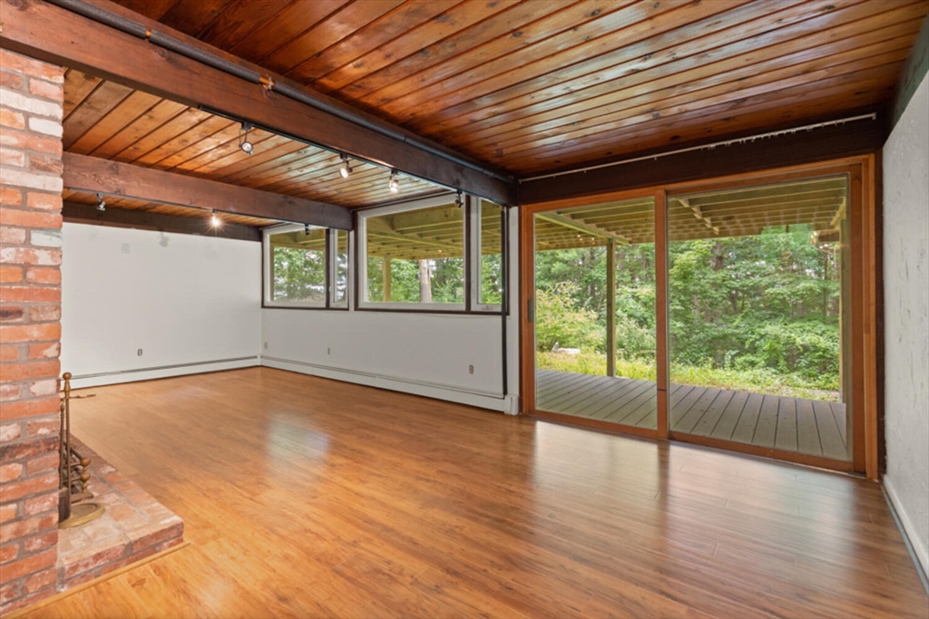 15 Pilgrims Path Sudbury, MA 01776 - Photo 17 of 29 a view of an empty room with wooden floor and a window