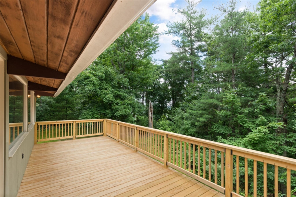 15 Pilgrims Path Sudbury, MA 01776 - Photo 22 of 29 a view of deck and yard with wooden fence