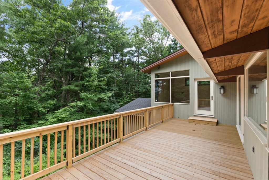 15 Pilgrims Path Sudbury, MA 01776 - Photo 23 of 29 a view of balcony with deck and wooden floor