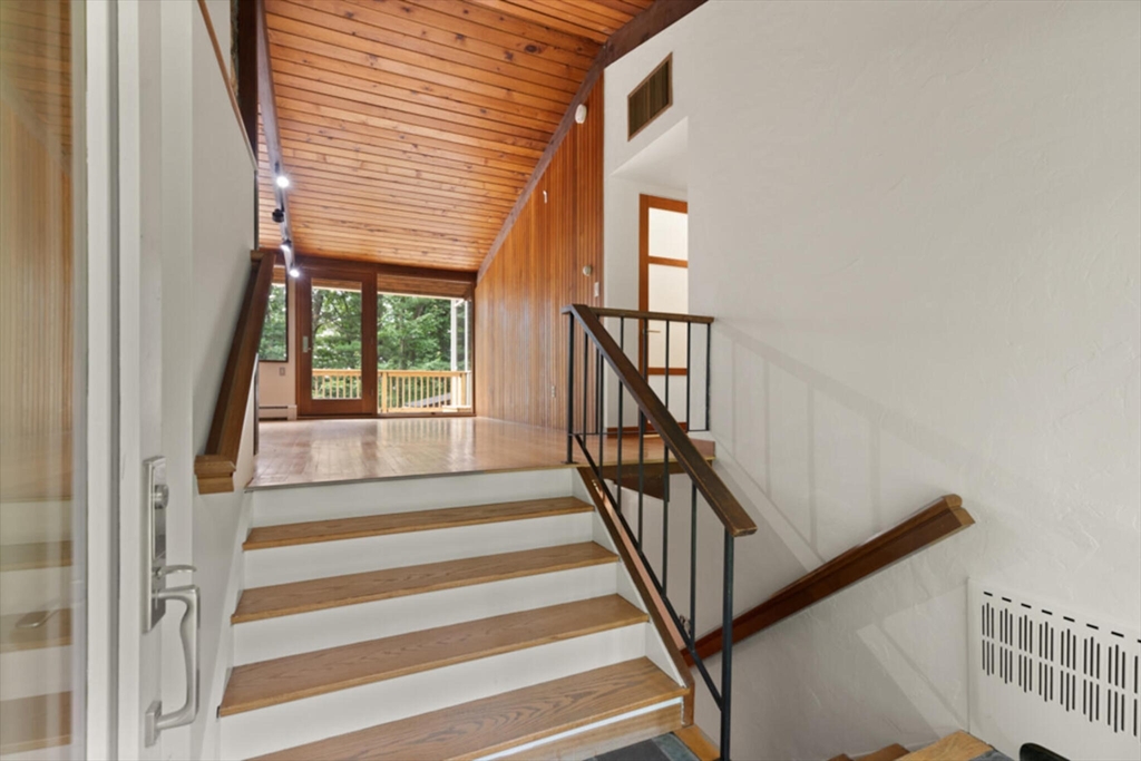 15 Pilgrims Path Sudbury, MA 01776 - Photo 3 of 29 a view of entryway with wooden floor and stairs