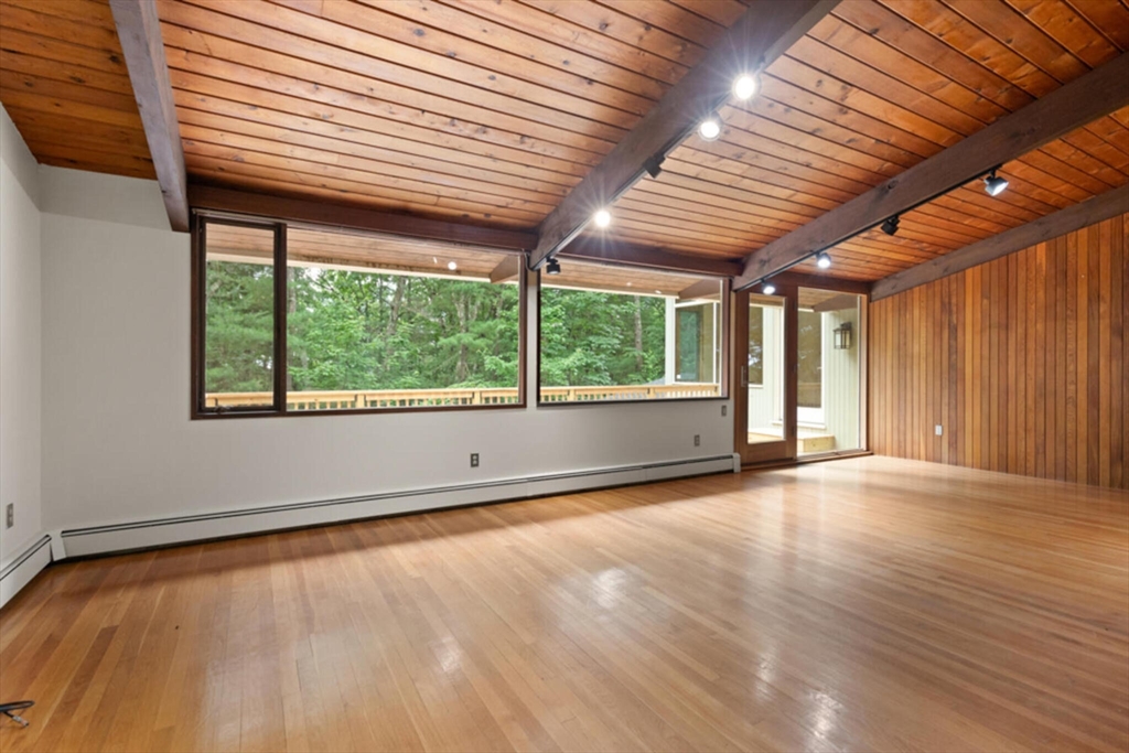 15 Pilgrims Path Sudbury, MA 01776 - Photo 7 of 29 an empty room with wooden floor and windows