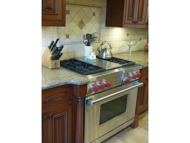 686 Regas Drive Campbell, CA 95008 - Photo 5 of 8 a stove top oven sitting inside of a kitchen