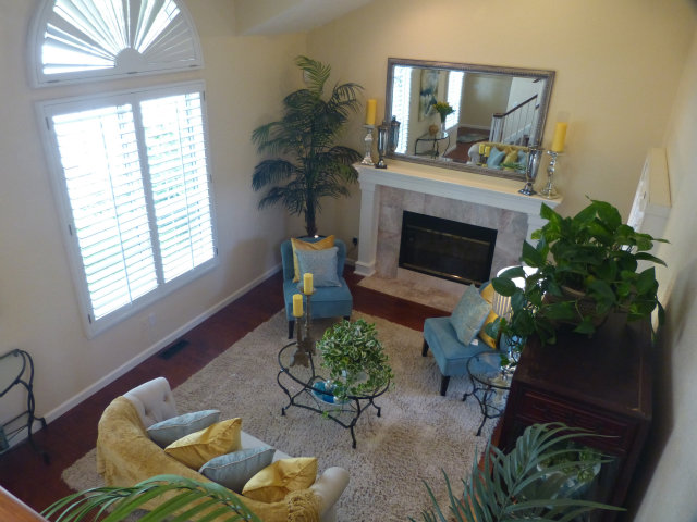 686 Regas Drive Campbell, CA 95008 - Photo 6 of 8 a living room with furniture potted plant and a fireplace
