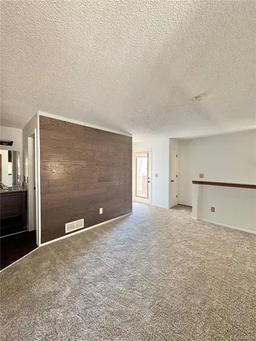 a view of a big room with a large tree