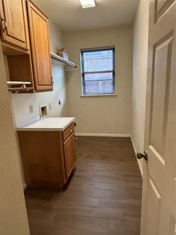 a bathroom with a sink a mirror and cabinets