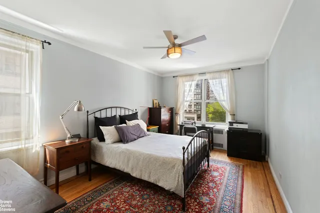 a kitchen with stainless steel appliances a sink a stove a refrigerator and cabinets