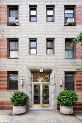 a group of people sitting on a bench in a room