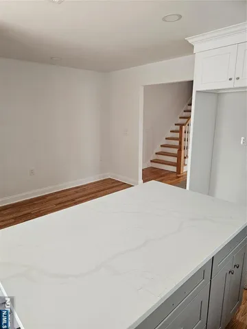 a bedroom with a bed and cabinets