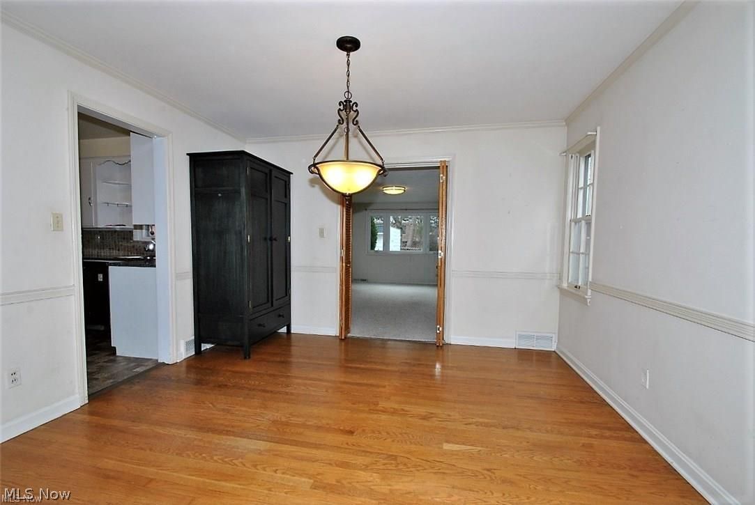3578 Latimore Road Shaker Heights, OH 44122 - Photo 6 of 25 Dining room has nice fixture, hardwood, flows to family room & kitchen