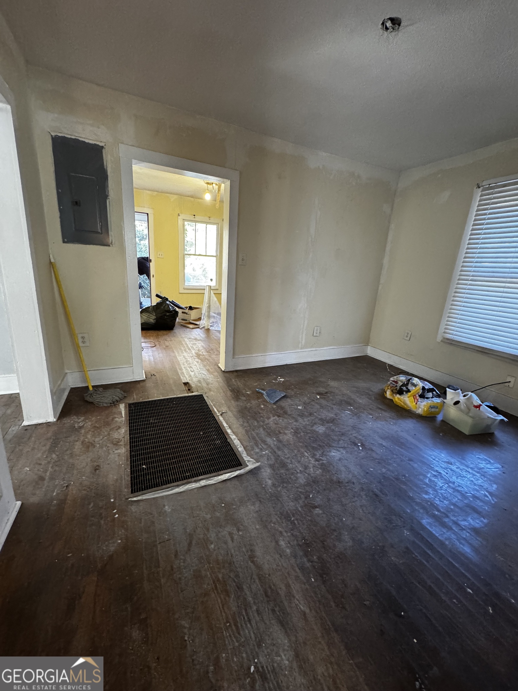 3828 Collier Drive Northwest Atlanta, GA 30331 - Photo 2 of 6 a view of a livingroom with wooden floor and a flat screen tv