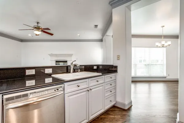 a kitchen with a sink and cabinets